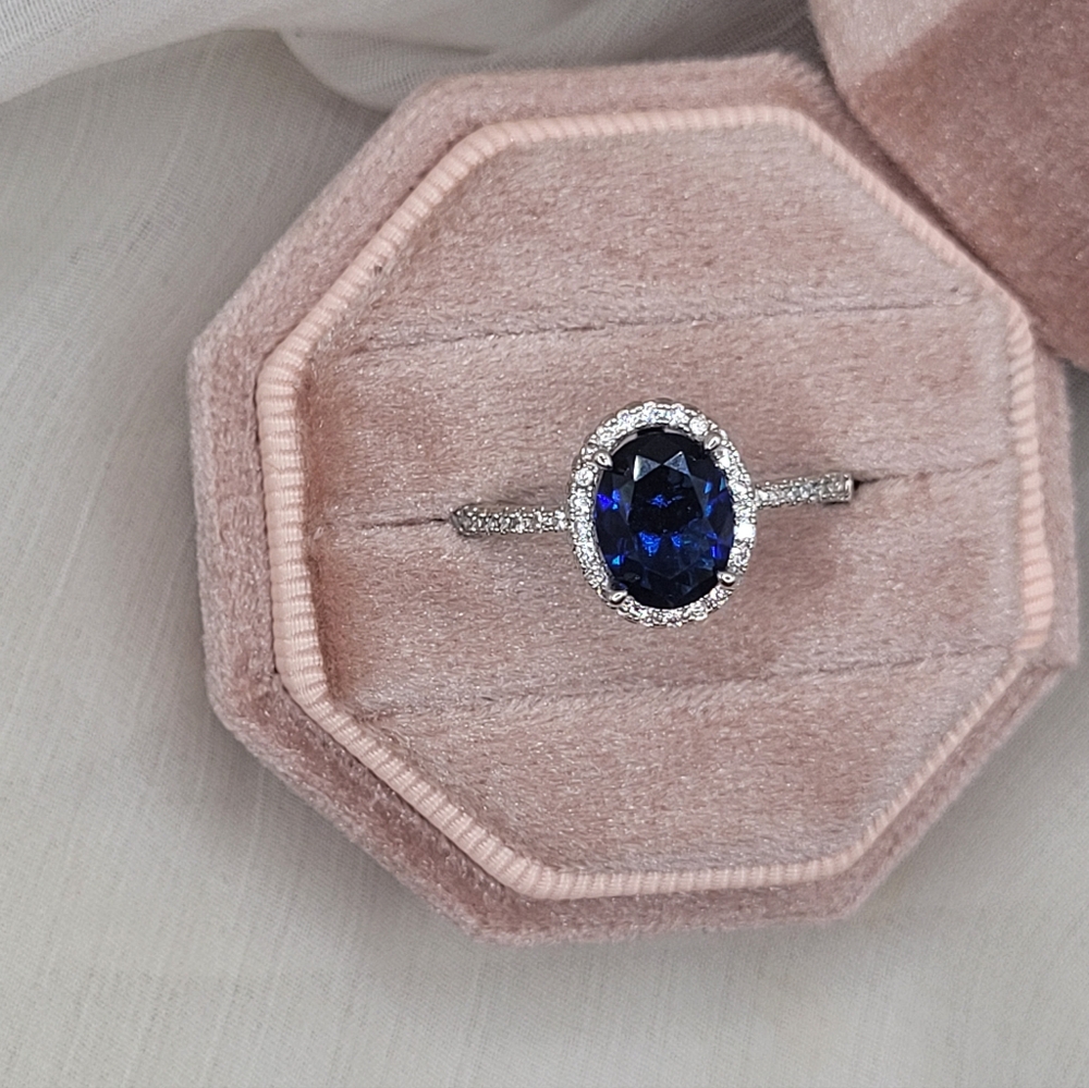 Elegant Oval Blue Sapphire Halo Ring in Sterling Silver